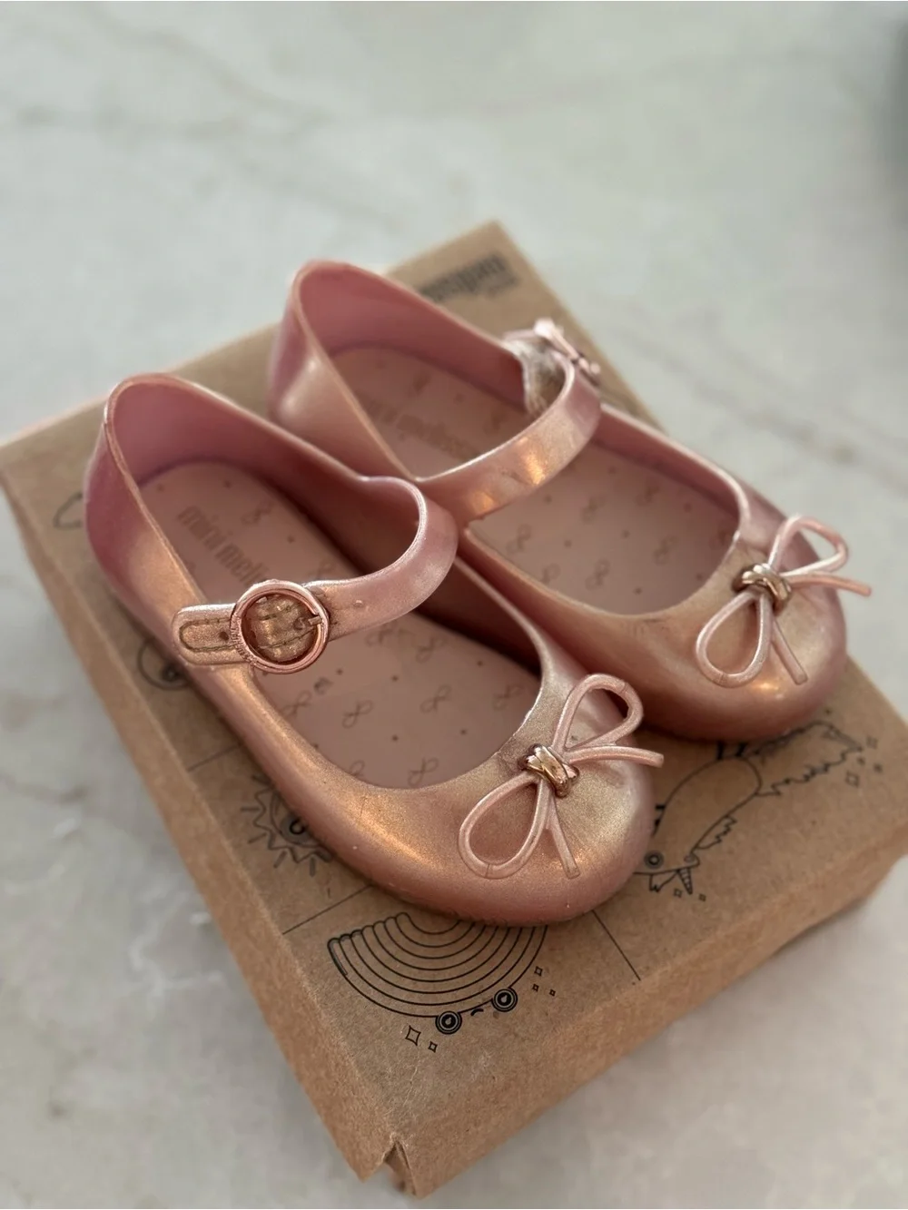 Mini Melissa Metallic Rose Gold Mary Janes with Bow Accent